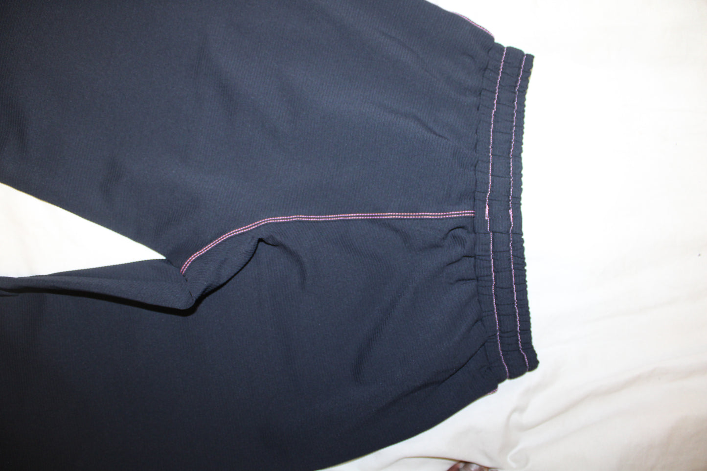 TWIYTC pink and black flared pants