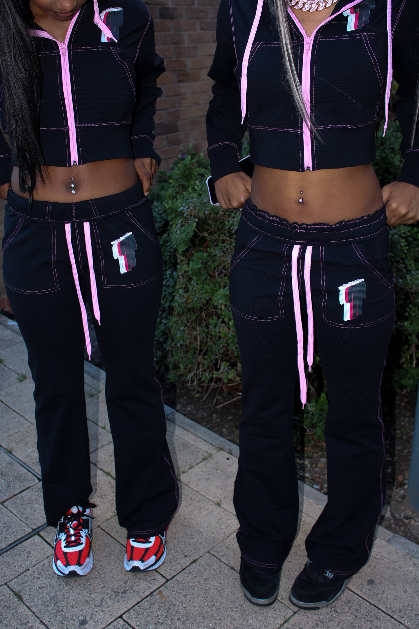 TWIYTC pink and black flared pants